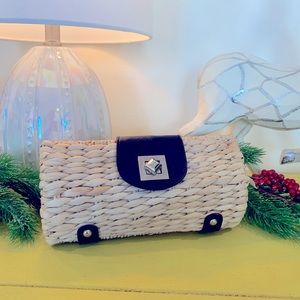 Straw clutch with navy leather features